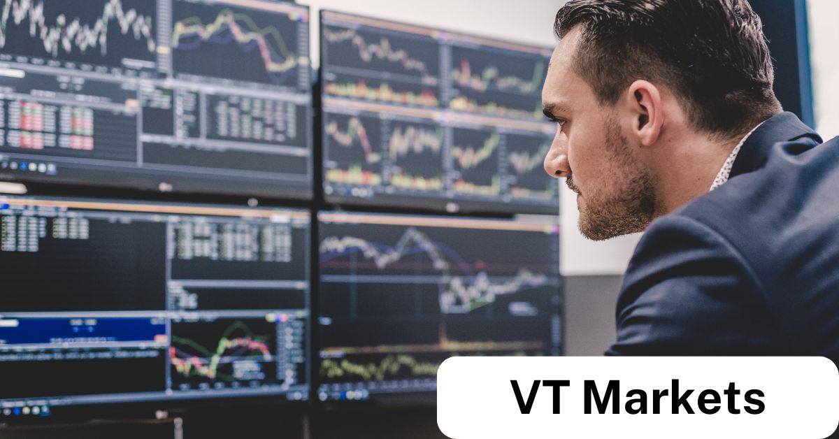Focused trader analysing multiple trading charts on desktop monitors, representing real-time decision-making and the tools provided by online CFD brokers like VT Markets.