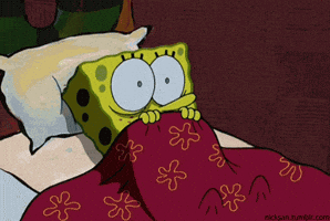 SpongeBob gif SpongeBob shudders and blinks with wide eyes as he lays in bed with the covers pulled up under his nose